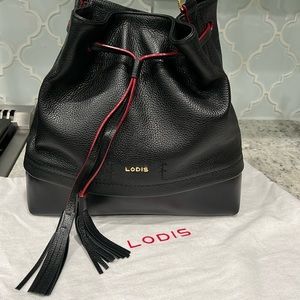 LODIS crossbody handbag. Black leather w/red trim paint.Excellent used condition